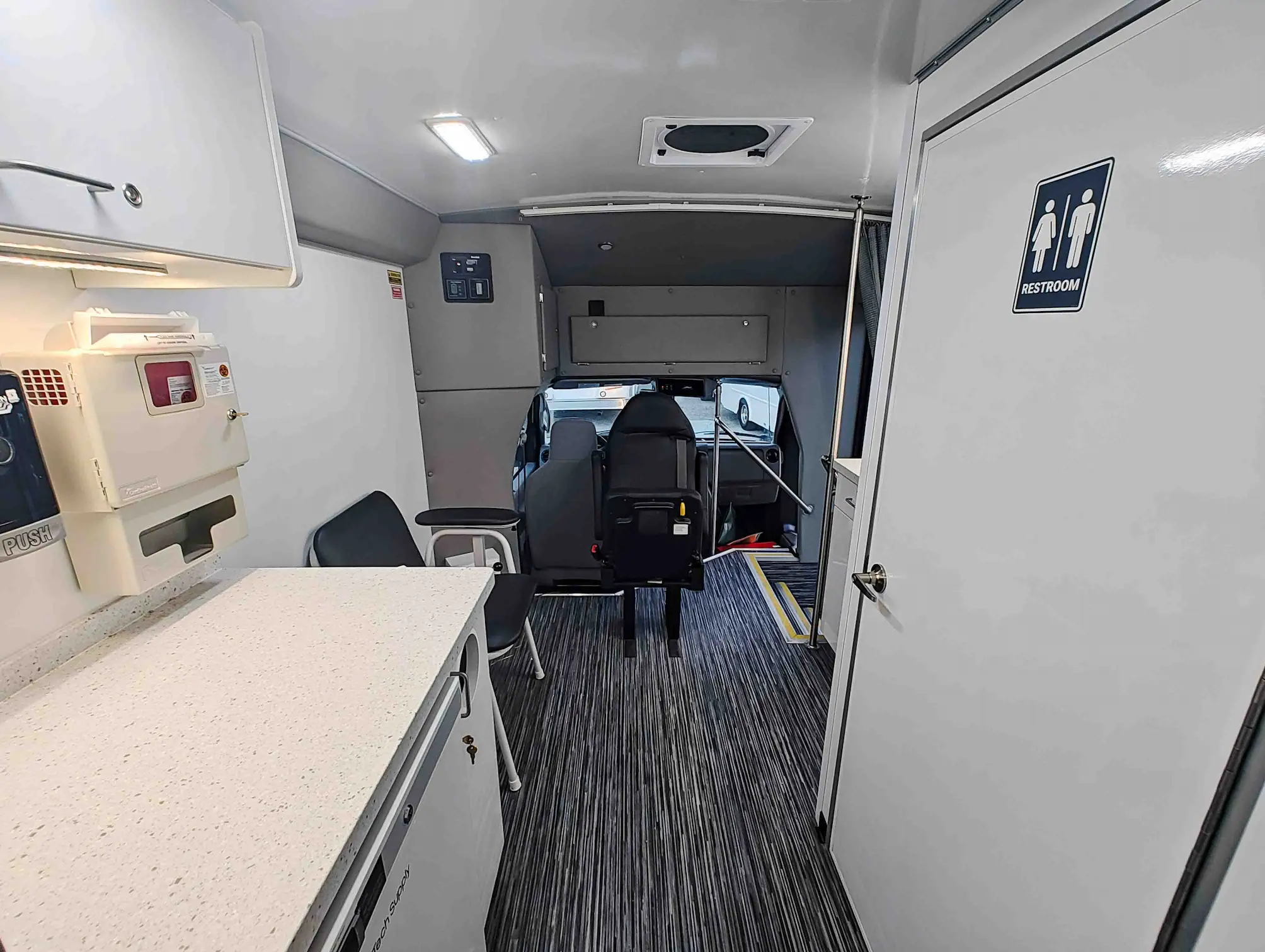 The inside of a Exam Room and Blood Draw Station Mobile Health Vehicle, Group C