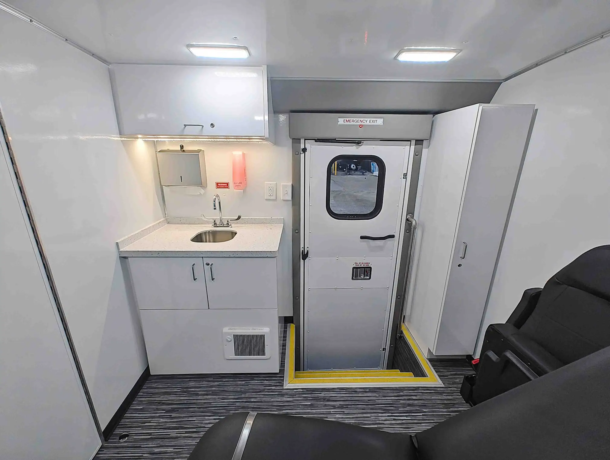 The inside of a Exam Room and Blood Draw Station Mobile Health Vehicle, Group C