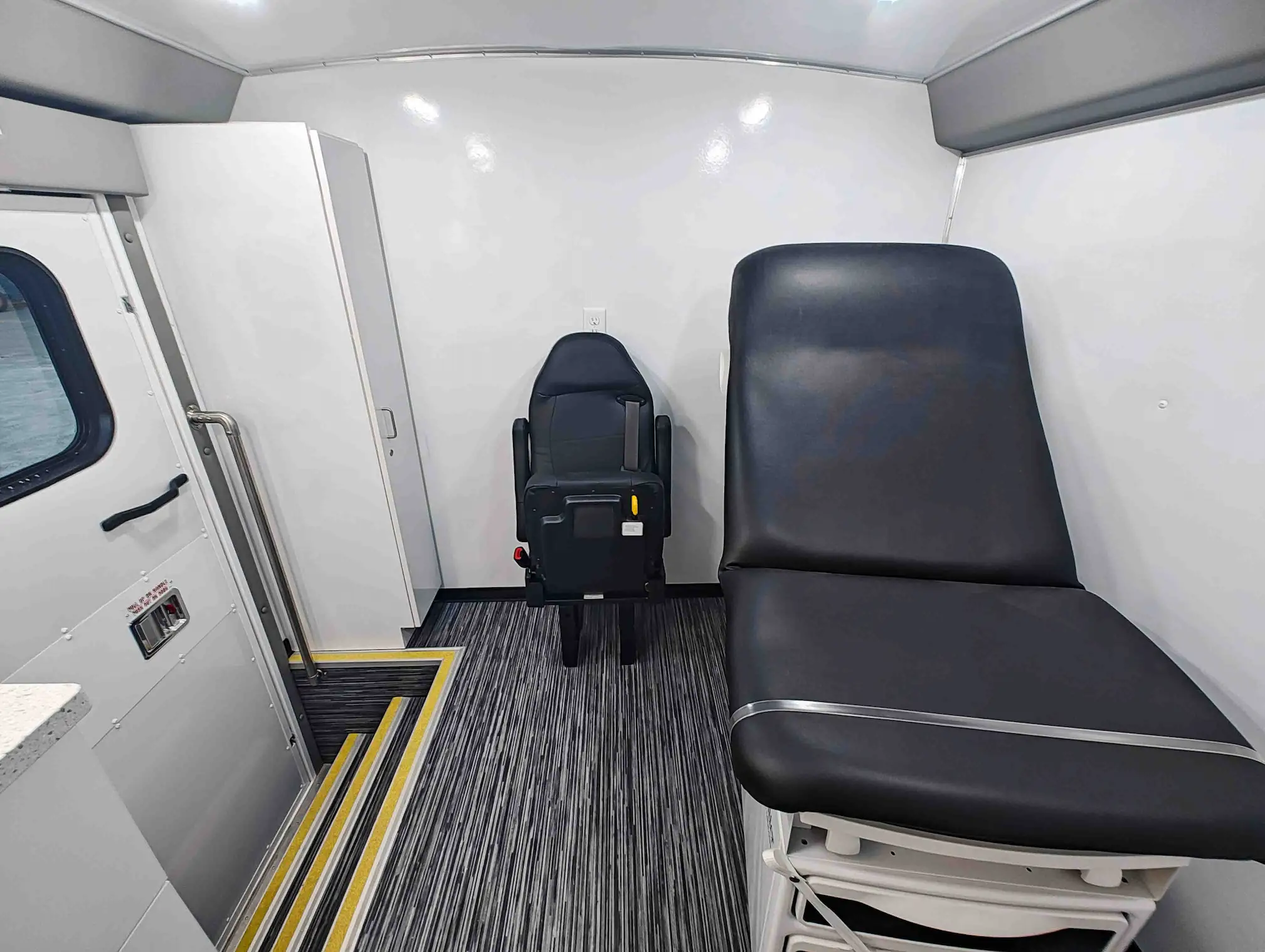 The inside of a Exam Room and Blood Draw Station Mobile Health Vehicle, Group C