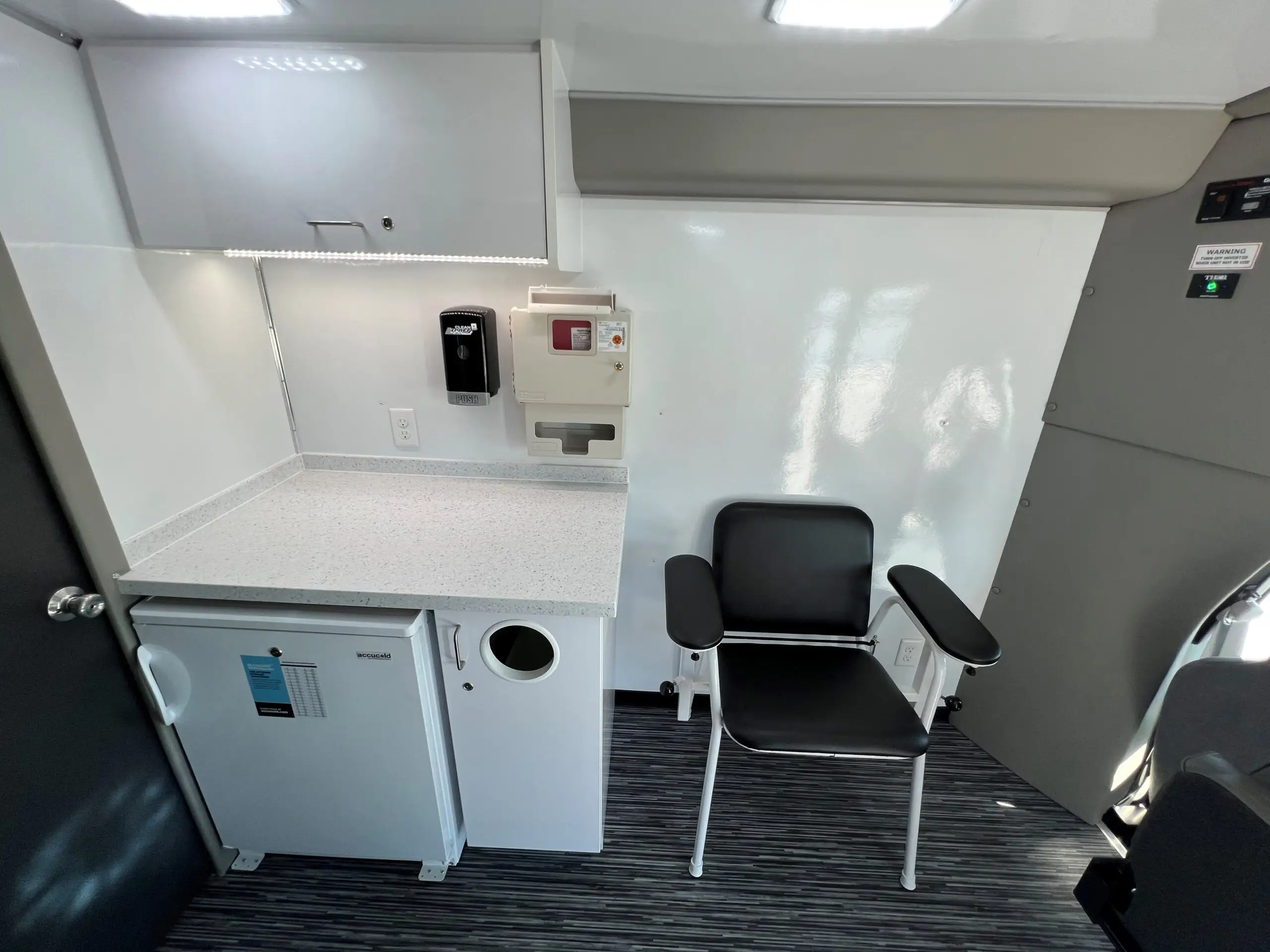 The inside of a Exam Room and Blood Draw Station Mobile Health Vehicle, Group C