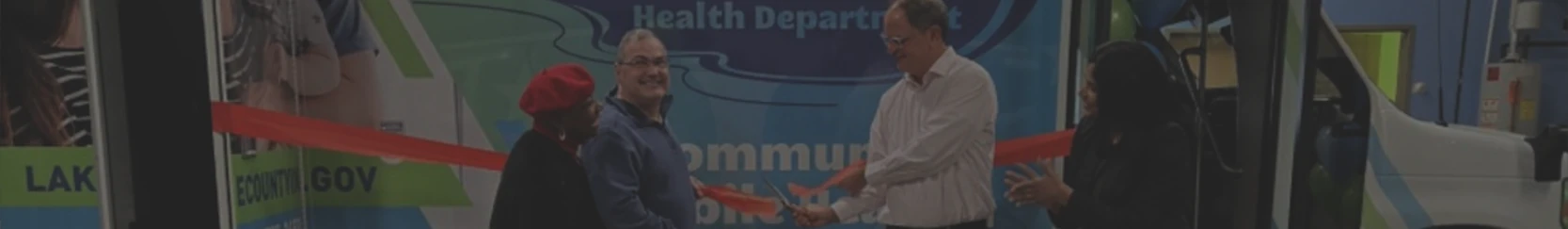 Unveiling ceremony of new mobile community health clinic vehicle with healthcare professionals