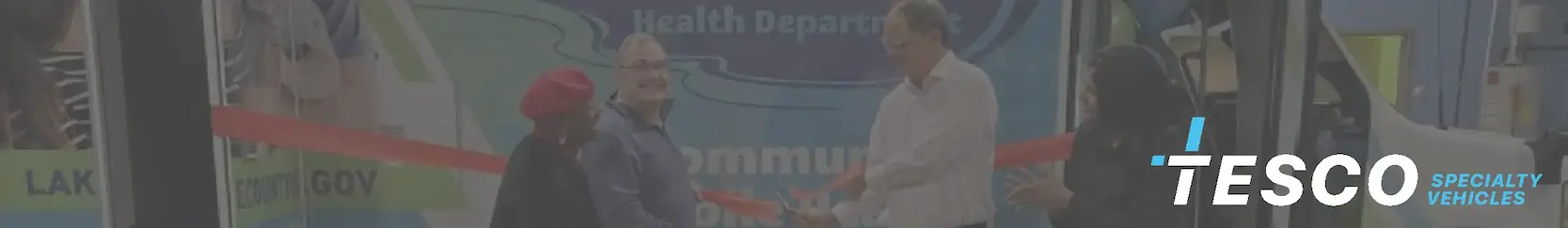 Unveiling ceremony of new mobile community health clinic vehicle with healthcare professionals