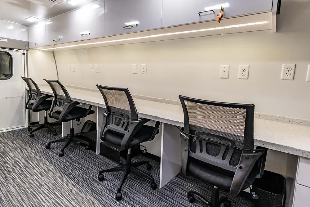 Mobile office interior with workspace and amenities