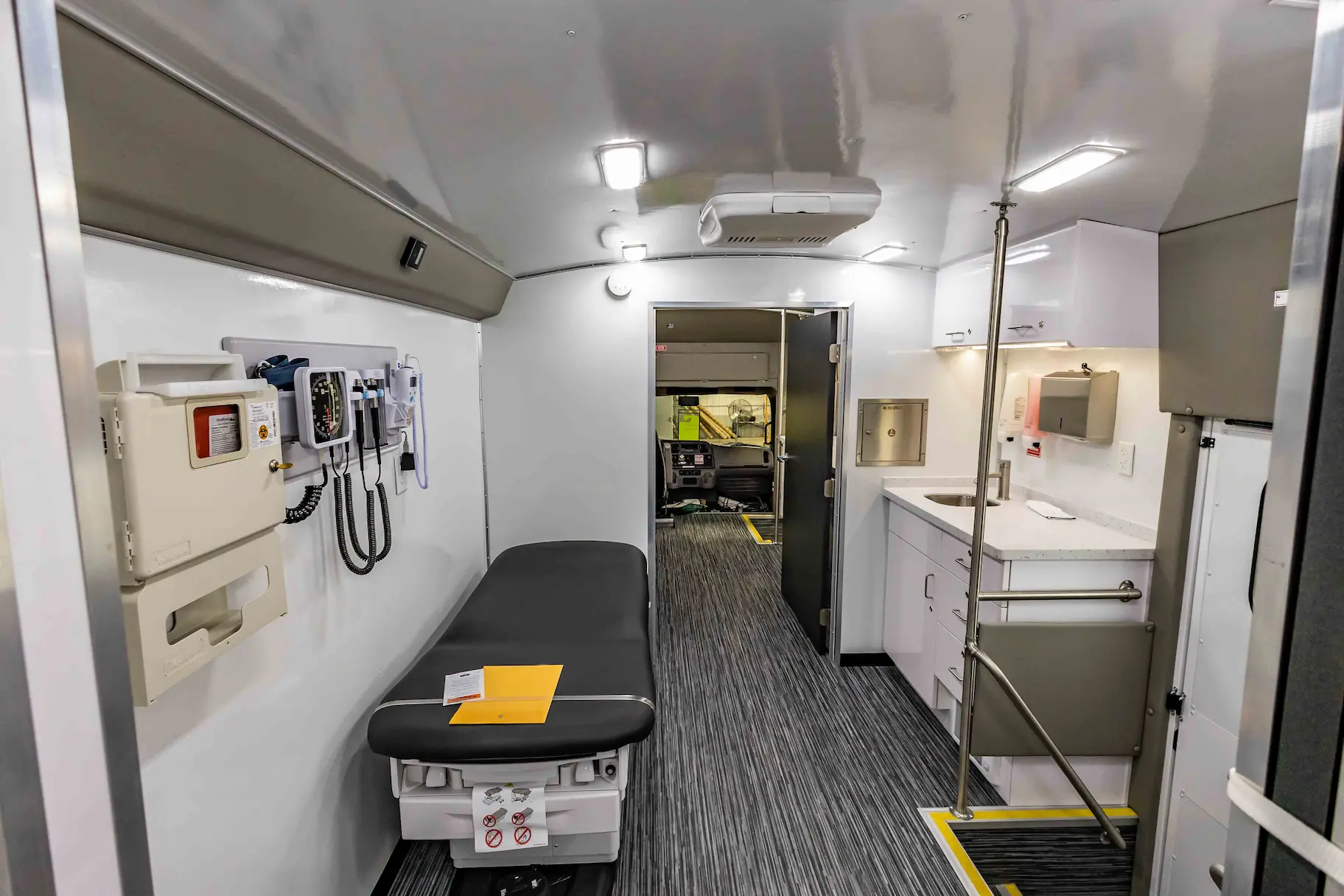 Interior of a used 2023 Two Exam Room Mobile Clinic w/ ADA Restroom and Office for sale