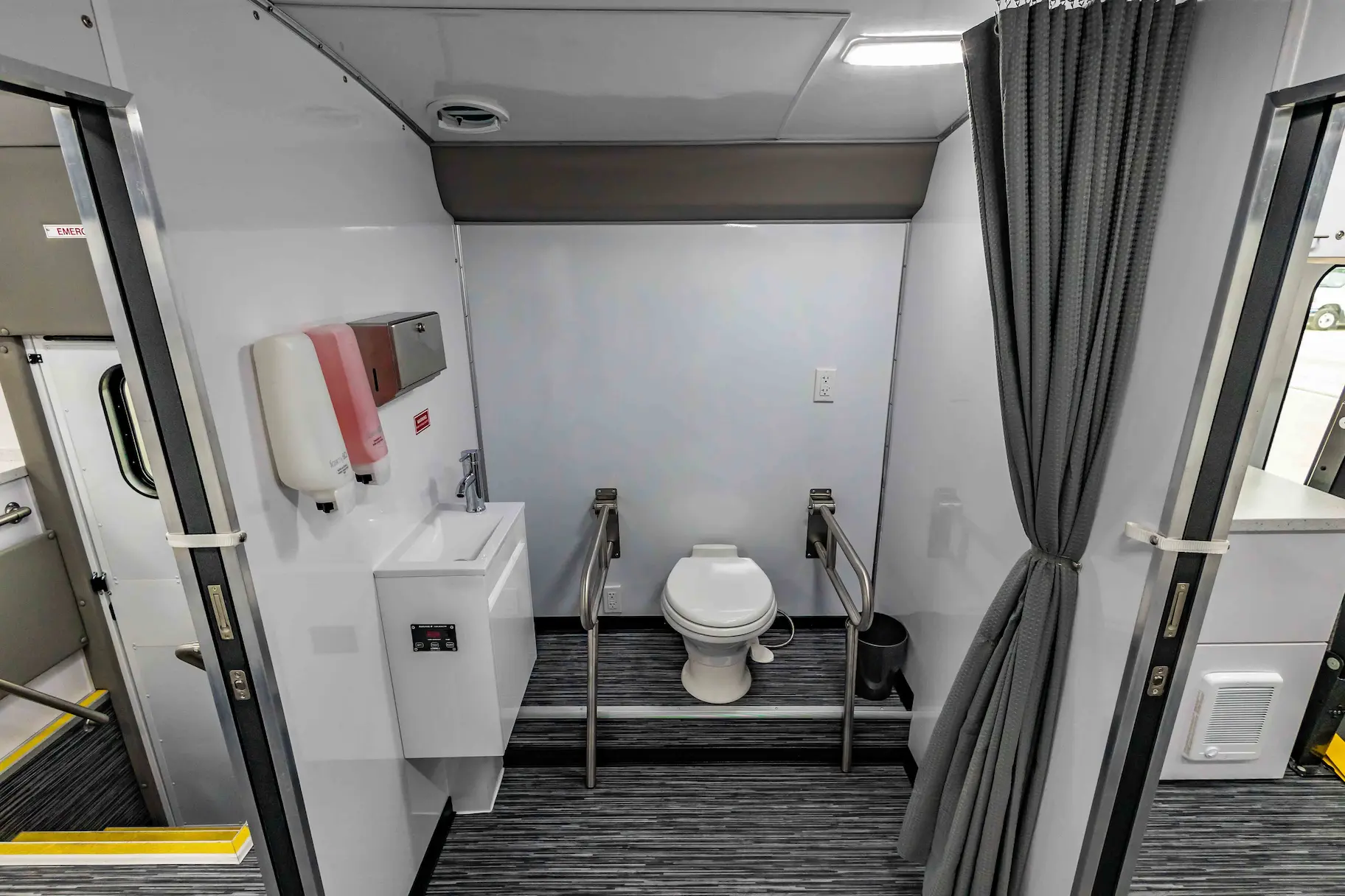 Interior with exam bed of a used 2023 Two Exam Room Mobile Clinic w/ ADA Restroom and Office for sale