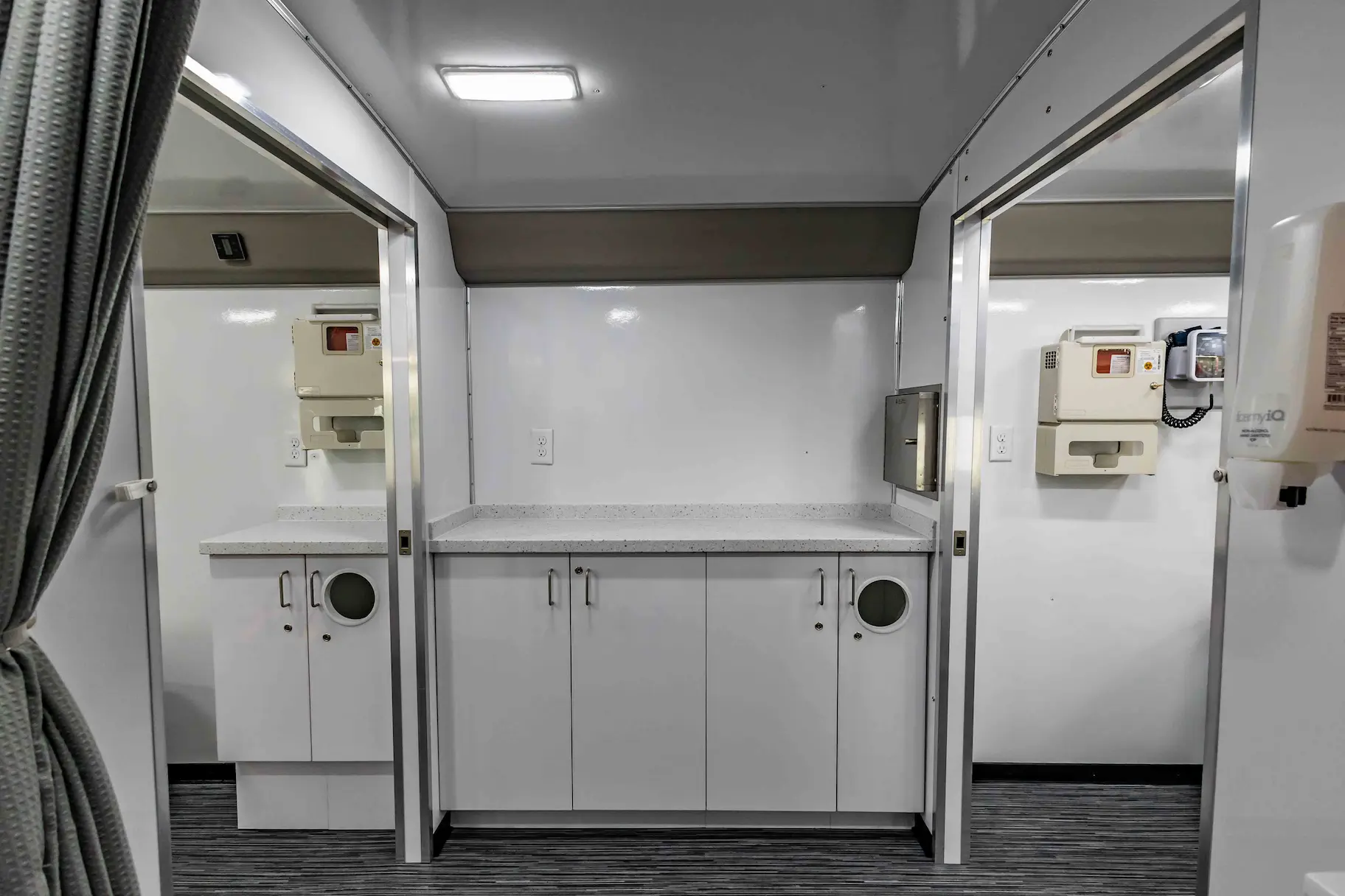 Interior with exam bed of a used 2023 Two Exam Room Mobile Clinic w/ ADA Restroom and Office for sale