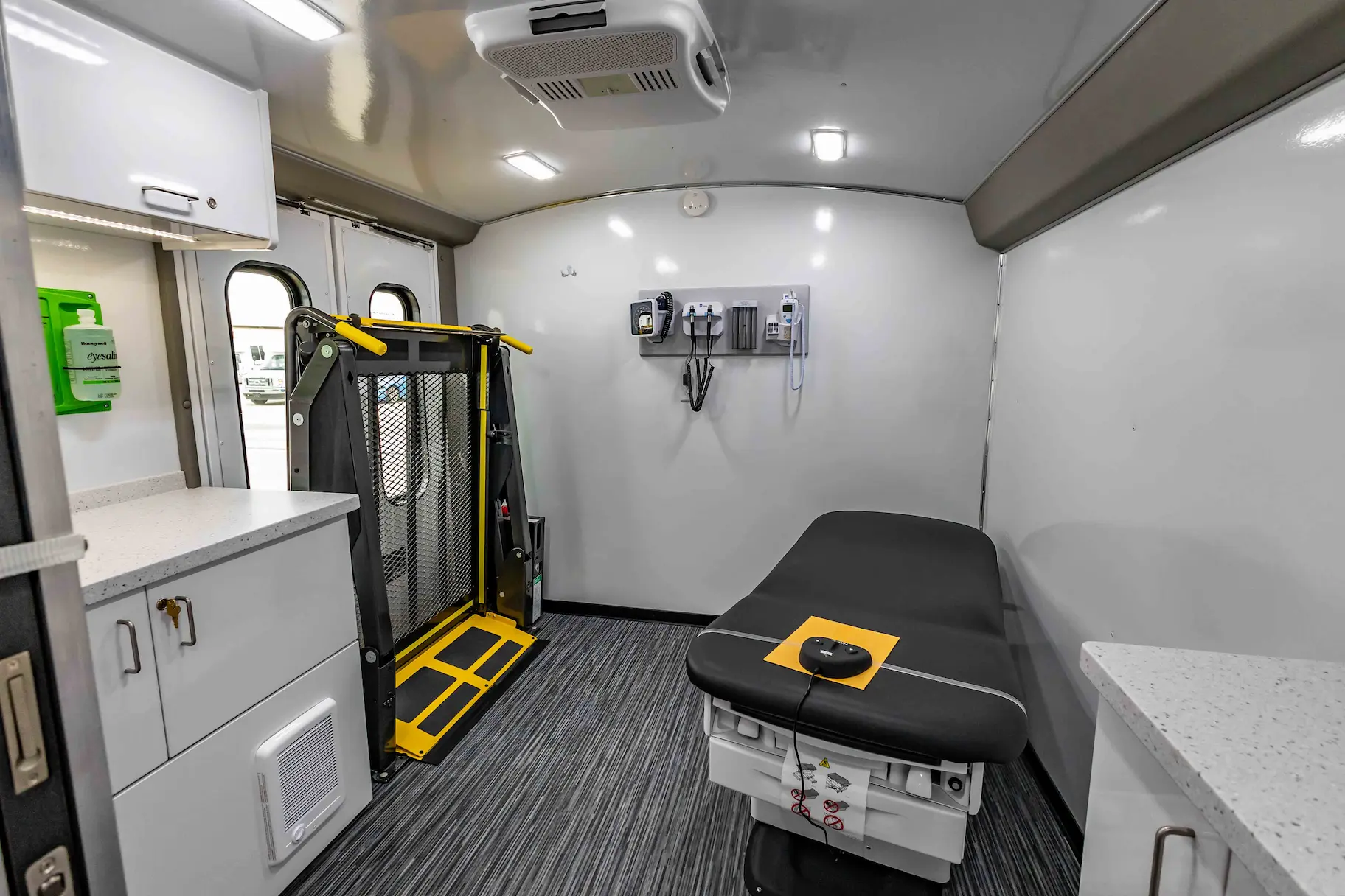 Interior with exam bed of a used 2023 Two Exam Room Mobile Clinic w/ ADA Restroom and Office for sale