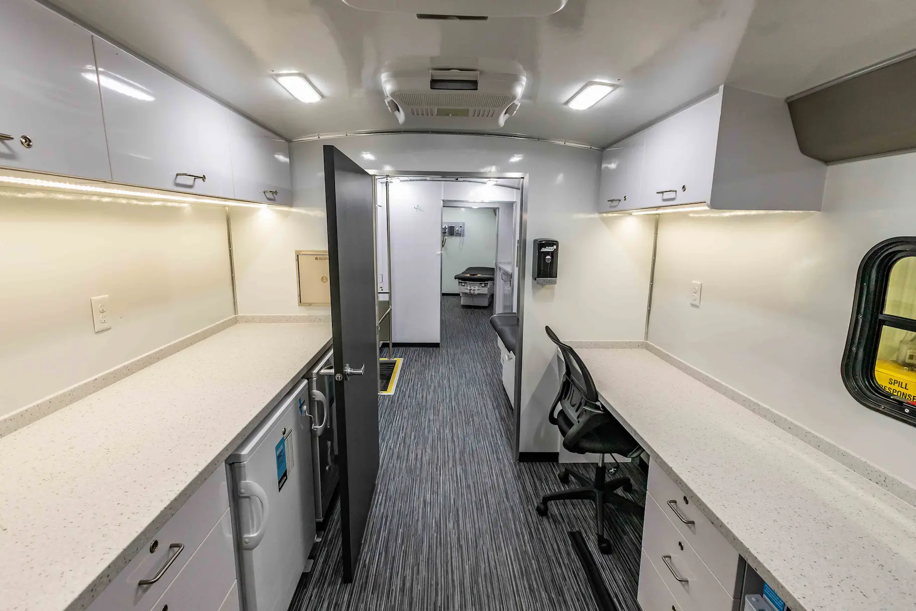 Interior of a used 2023 Two Exam Room Mobile Clinic w/ ADA Restroom and Office for sale