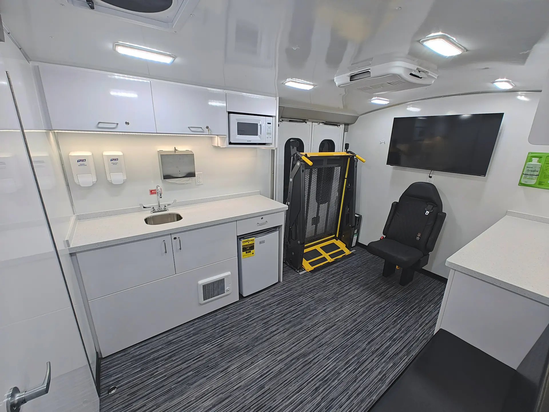 Interior of the City of Norfolk Mobile Workforce Center showing workstation counters along the side wall